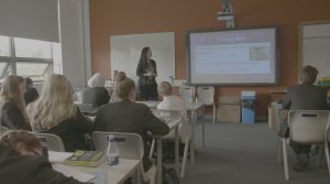 Young People Listen To Financial Education Workshop