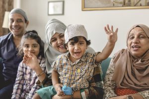 Muslim Family Smiling At Home