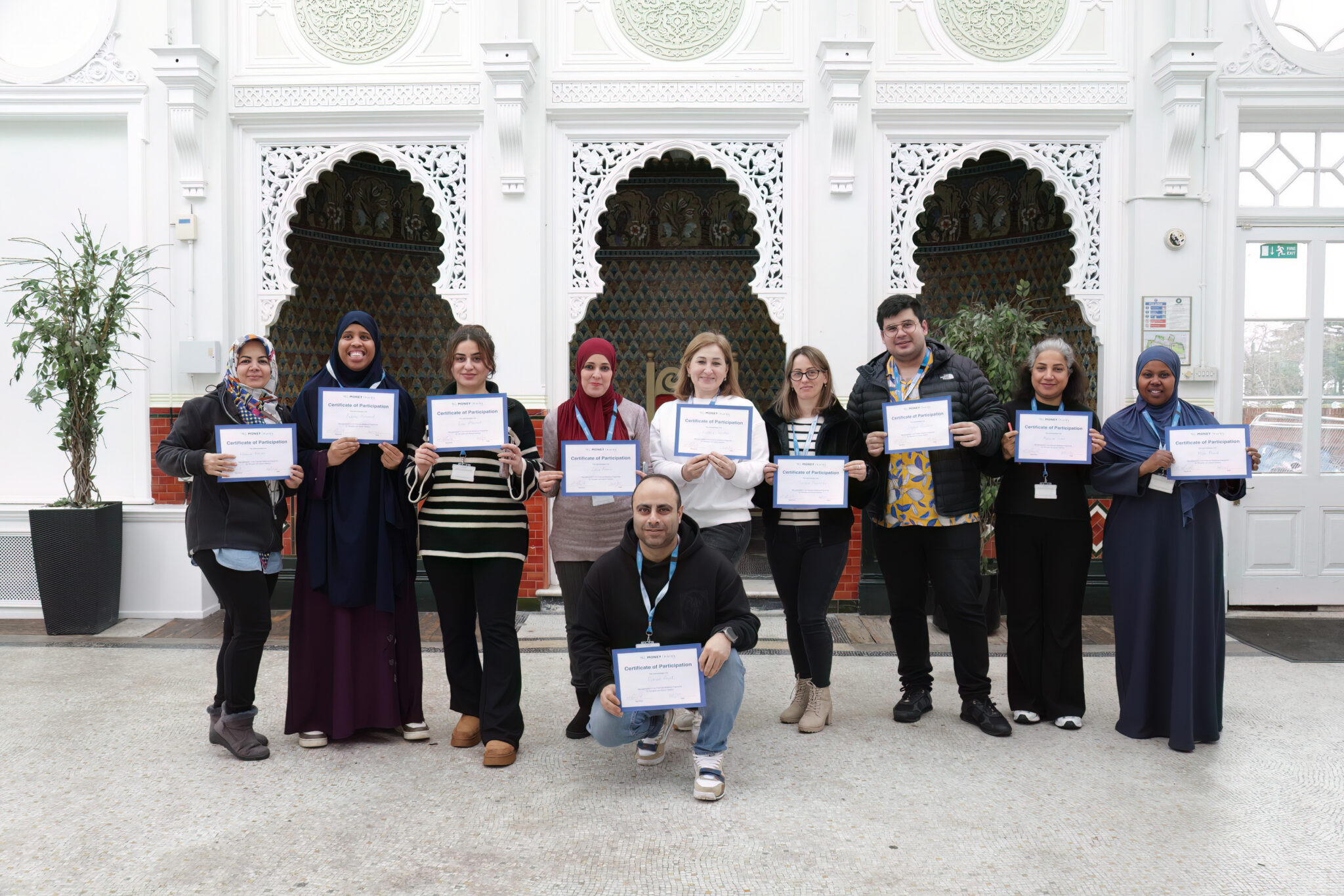 A group of students holding certificates